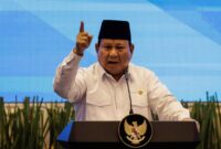 Indonesias President Prabowo Subianto speaks during the launch of a new system for directly transferring allowances to regional public school teachers' bank accounts at the Primary and Secondary Education Ministry in Jakarta on March 13, 2025. (Photo by Yasuyoshi CHIBA / AFP)