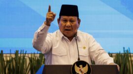 Indonesias President Prabowo Subianto speaks during the launch of a new system for directly transferring allowances to regional public school teachers' bank accounts at the Primary and Secondary Education Ministry in Jakarta on March 13, 2025. (Photo by Yasuyoshi CHIBA / AFP)